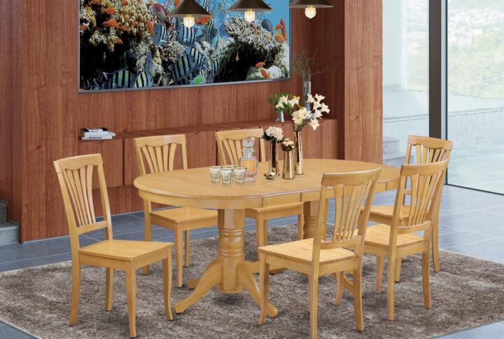 The Vancouver dining table set features traditional style with the attractiveness deserving of formal dining and entertaining those special guest visitors. The oval-shaped dining table shows impressive design and style with its show-stopping double pedestals. Gorgeous in a lovely Oak color