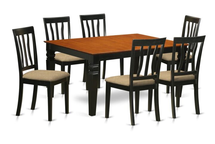 Matching Black And Cherry Finish Solid Wood Table Set Having Nice Beveled Edge On Trim. Vintage Rectangle-Shaped Dining Table Having 4 Legs. Recessed Details On Kitchen Table And Dining Chair Legs For Extra Support And Attraction. Beveled Carving On Legs Of Matching Table And Chairs. Small Table Having 18 In Self Storage Foldable Leaf In Kitchen Center Made For Casual Or Formal Atmosphere. 7 Pc Kitchen Set With A Single Weston Dinning Table And 6 Cushion Kitchen Area Chairs Finished In An Elegant  Black and Cherry Color.