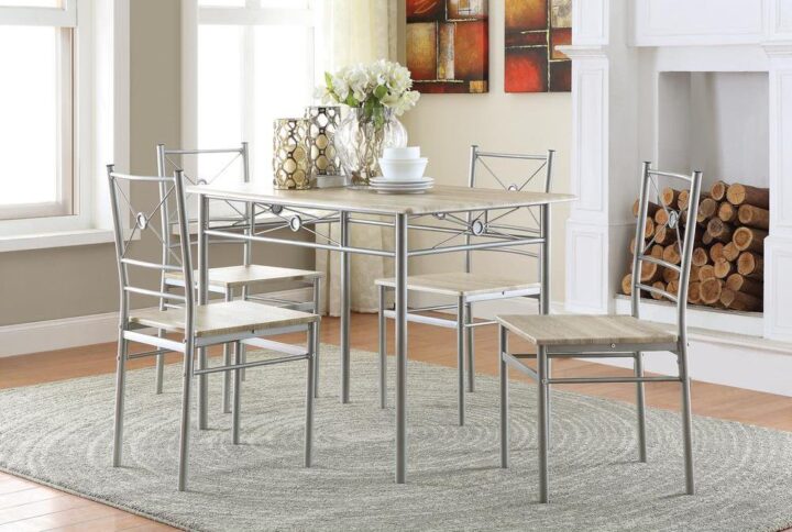 Gather loved ones for a toast around this stylish dining set and create cherished memories to last a lifetime. Constructed from strong metal tubing and high-quality vinyl