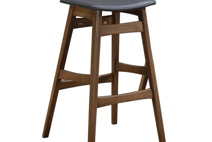 Keep it simple in a casual space. Bring farmhouse-inspired charm to a pub table or counter. This barstool offers a minimalist silhouette with gentle angles. Built from select walnut veneer and solid hardwoods