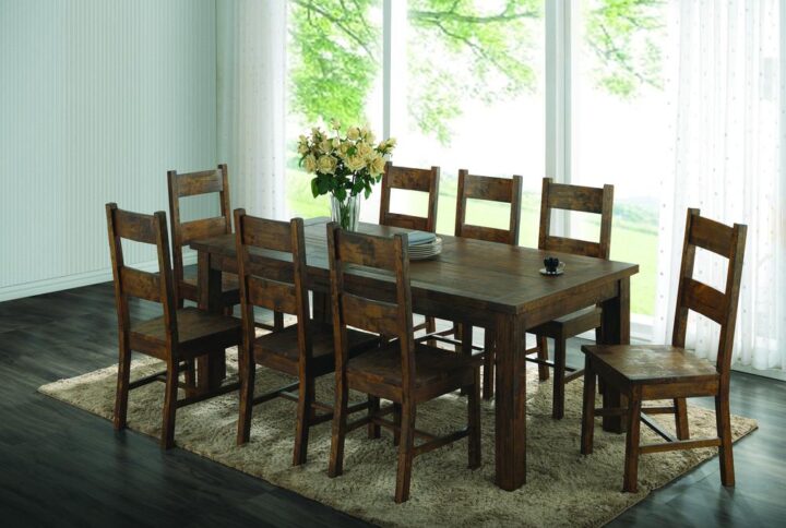 Add a bucolic ambiance to the dining room with this 5-piece dining set. It includes a rectangular table and four side chairs