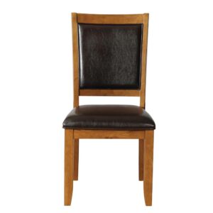 yet sturdy dining chair. Hardwood construction is durable enough for hasty breakfasts or leisurely dinners. Padded seat and backrest are comfortable enough for nightly web surfing. Slightly curved backrest and angled back legs lend a profile as pronounced as the signature style of your home. Finished in deep walnut brown and dark brown leatherette that matches your coffee or bourbon (or both).