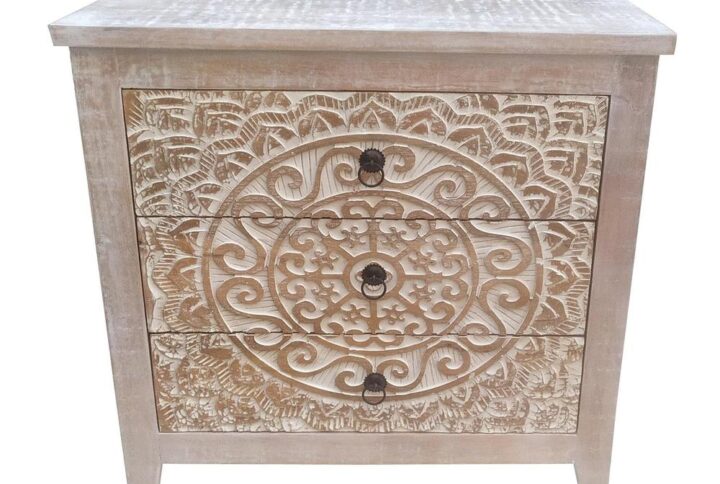 An ornate medallion brings boho charm and artisan character to a farmhouse accent cabinet. Easily doubling as a side table