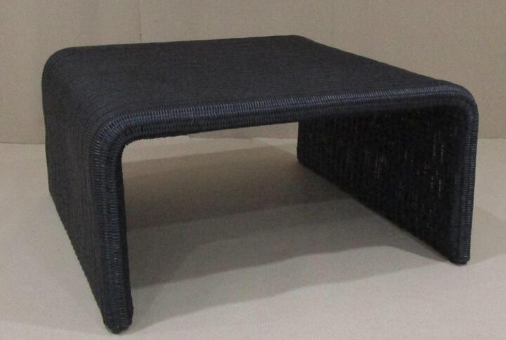 Repurpose the retro feel of a classic design as you choose pieces to outfit a casual space. This coffee table features a minimalist inverted U-shape silhouette revisits 1970s furniture style and serves its purpose well. Made of black metal with a woven surface