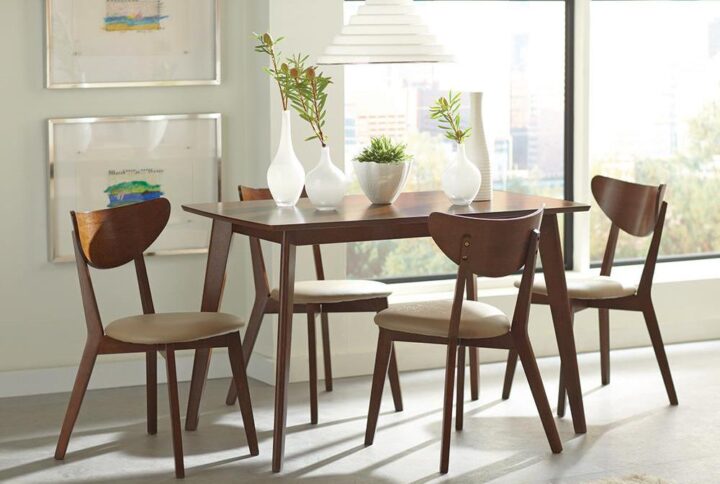 It’s easy to enjoy mid-century modern style in small spaces with this five-piece dining table set. A sleek and simplistic dining table is constructed with a rectangular tabletop and tapered legs