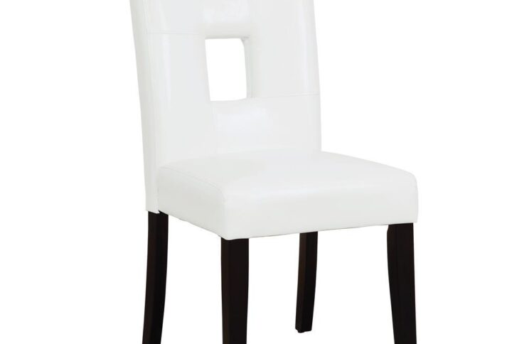 Transform your dining area when you add this dining chair from the Anisa collection. The dark cappuccino finished legs offer an eye-popping contrast to the white leatherette upholstery. Slightly angled back legs and flared back evoke a nonchalant demeanor. The open square in the middle of the cushioned seat back is a distinctive touch. Be careful - guests may take your seat when you're in the kitchen getting seconds.