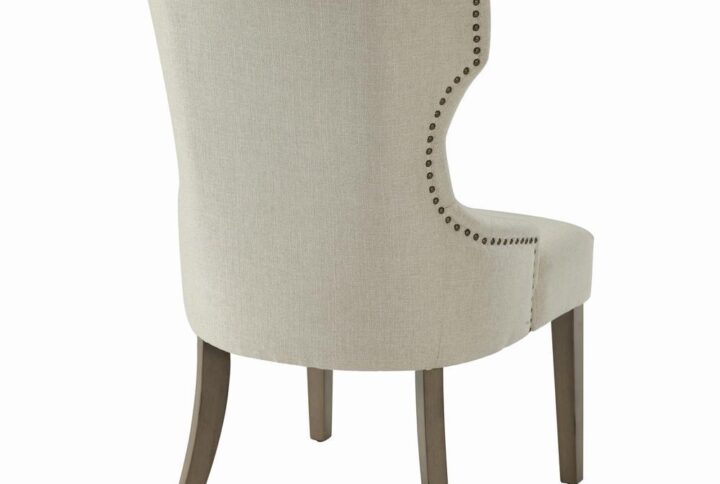 Enjoy an intriguing silhouette with a classic look. Graceful curves and angles form an eye-catching design in this dining chair. Perfect for transitional spaces