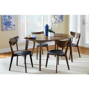 The Malone Collection includes this extendable modern dining table. Solid wood construction and angled legs allow for durability against daily use. Removable leaf extends for an oval shape that welcomes a close-knit gathering. Finished in dark walnut for a condo in the city or a log cabin in the mountains. Pull up a chair with cushioned seating and enjoy a home-cooked meal.