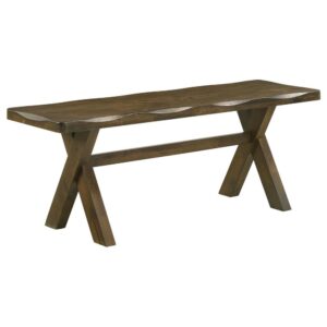 This wooden bench has a simple silhouette that exudes no-nonsense appeal. It makes a handsome addition to a dining area with a traditional country decor. Designed with worn edges and a knotty nutmeg finish