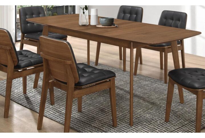 The Redbridge collection offers this wood dining room table as a highlight of its dining collection. Table features a mid-century modern design that's sure to please. Top has an extension leaf that works well in places where space efficiency is a premium. Two-tone shape and curves provide optimal comfort and styling. This table is a showcase piece for a casual or formal dining room space.