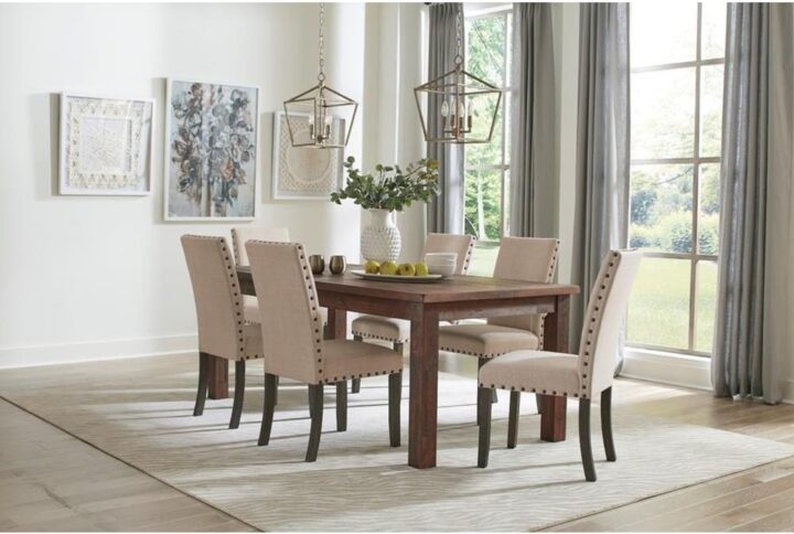 Warm finish tones and a tasteful design scheme turn your casual space into a fabulous setting for entertaining as this dining set adds earthy attitude and superb comfort. Relax in style around a rectangular dining table made of rustic golden brown finish Asian hardwoods. Clean lines and a chunky motif bring ranch-inspired personality to soften your vibe. Kick back in high-back side chairs upholstered in luxurious fabric