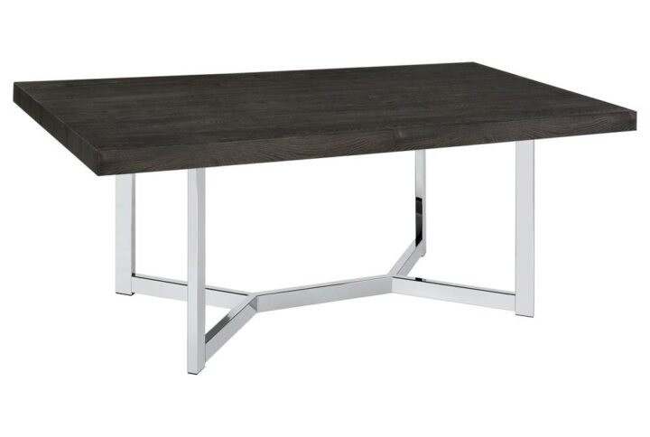 Transform your dining room with a striking statement piece - an ultra-modern trestle dining table. Its sleek two-tone finish showcases a lustrous chrome metal base and a thick dark oak finished table top