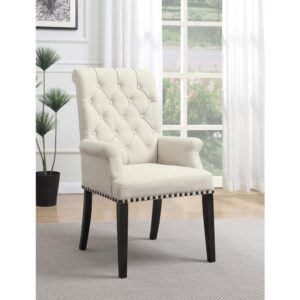 Concentrate on an artistic aesthetic. Bring a charming upscale look to a casual space with this elegant dining chair. Romantic elements include slightly rolled track arms and a tufted chair back. Nailhead trim delivers a charming bonus. With a smokey black finish
