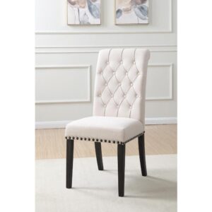 Stick with a stylish elegant impact. An extra high back dominates the alluring silhouette of this dining chair. Fresh beige linen upholstery stylizes and brightens any space. Charming tufting on its seat back and nailhead trim supplies plenty of accenting. Tasteful smokey black finish legs offer slight curves in back.
