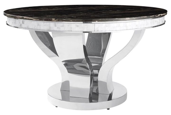 This uniquely-designed dining table has a solid appeal that's sure to please. It has a large round top with a handsome marble-like design. The table edge is fashioned in contrasting burnished silver. The curved silver legs are wide for a strong