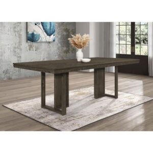 Take your dining experience to new heights with our chic transitional table. The sleek dark grey finish