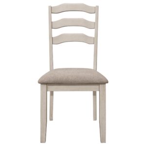 Enhance the cozy atmosphere of your dining space with our modern farmhouse and coastal cottage dining side chairs. These ladder back chairs exude a charming rustic appeal with their distressed cream finish on the legs and back. The khaki polyester fabric upholstered seat ensures optimal comfort during meals.
