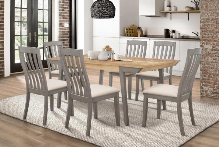 A noticeably pleasing finish palette stands out in the elegant design of this seven-piece wood dining set. Dress up your casual space with a surprisingly light look and interesting blend of colors. Start with a modern design in a natural acacia finish wood table with a true square edge. Angled legs feature a stunning coastal gray finish