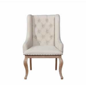 the chair boasts diamond button tufting across its back