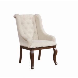Go full-scale indulgent with this inviting dining arm chair. Beautifully upholstered in a neutral tone
