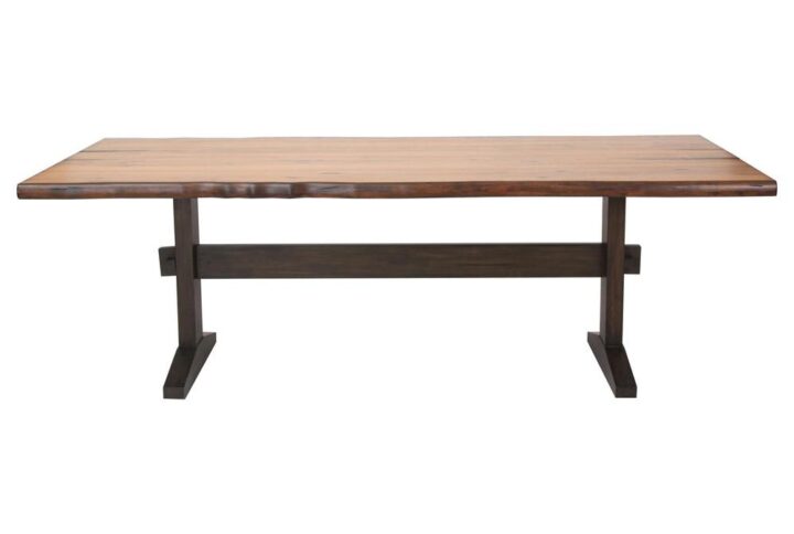Rugged edges create a sense of rustic character for this wood dining table. Perfect for a family of six
