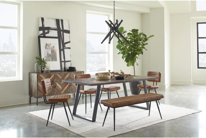 Retro charm is on full display in a dining ensemble that recreates a popular past era. Warm tones and a festive look indulge Mid-Century Modern attitude in this five-piece casual dining set. A rectangular wood and iron dining table anchors this stylish set