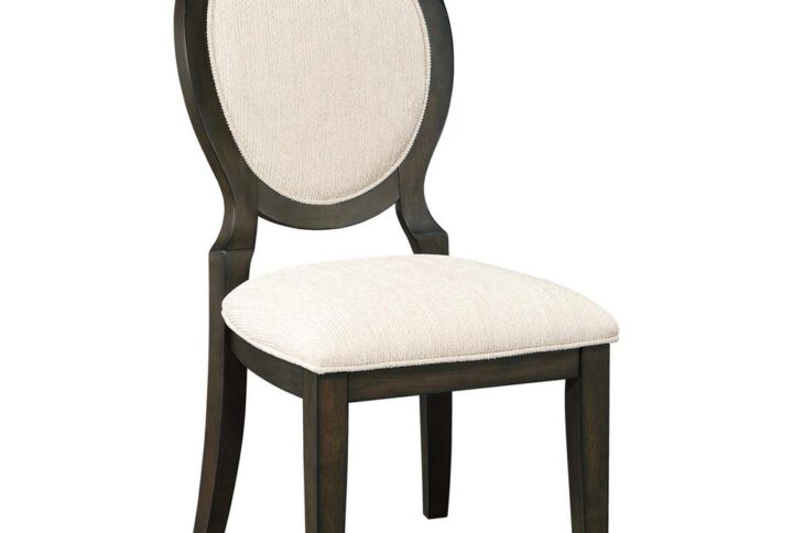 Elegant curves and contrasted finishes collide in this transitional side chair. A lovely addition to a dining space