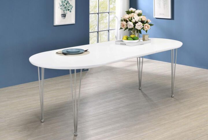 Elegant curved and sleek elements come together in this spacious modern dining table. Designed with hairpin metal legs in a shiny chrome finish