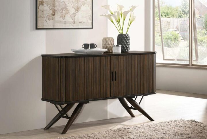 Elevate your dining area with this mid-century modern server. Beautifully designed with campaign style influences