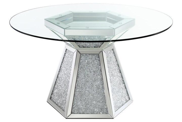 Make the most of your spacious dining room with this modern glam dining table. A round clear glass top seats four to six guests easily for dinner parties. Beneath the round top is a hexagon-shaped