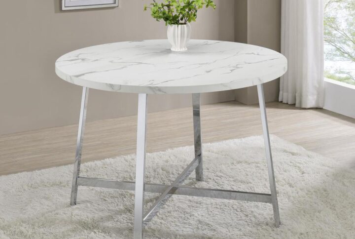 Indulge in the retro charm of mid-century modern design with this stunning faux Carrara marble dining table. The sleek