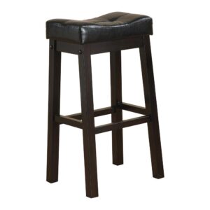 the stool features a backless and armless silhouette. Its curved seat boasts black leatherette upholstery with tufting. Easy to maintain