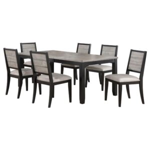 Elevate your dining experience with this farmhouse-inspired two-tone finished dining set. The table extends from 60" to 78" with an 18" extension leaf and features a wood on metal glide for smooth transitions. The side chairs