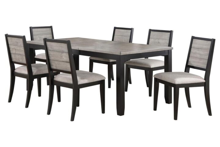 Elevate your dining experience with this farmhouse-inspired two-tone finished dining set. The table extends from 60" to 78" with an 18" extension leaf and features a wood on metal glide for smooth transitions. The side chairs
