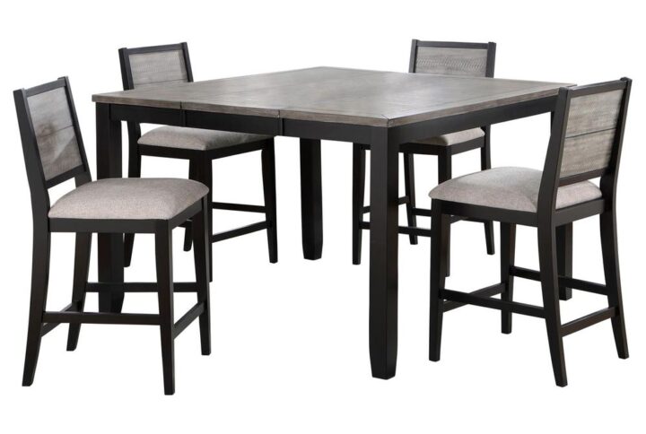 Upgrade your dining room with this charming farmhouse-style counter height dining set. The counter height table