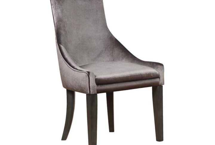 Bring romance and sophisticated style to a transitional space. Elegance abounds in this everyday dining chair that hints at a formal motif. Luscious grey upholstery offers cool tones and a versatile palette. Dark charcoal finish wood legs echo a charming retro style with graceful curving on the two back legs and tapered front legs. Experience superior comfort in a padded seat and sloped