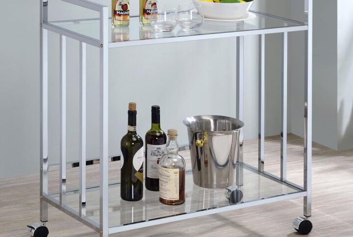 Welcome guests and serve up libations with this sleek contemporary bar cart. A rectangular silhouette outlined in a slim