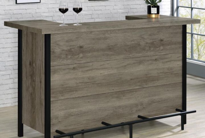 Add functionality and style to an entertainment space with this rustic bar unit