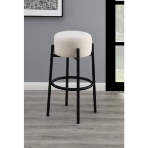 slide this pair of contemporary stools up to a bar or kitchen breakfast area. Designed with a thick pouf-like cushion wrapped in a white upholstery