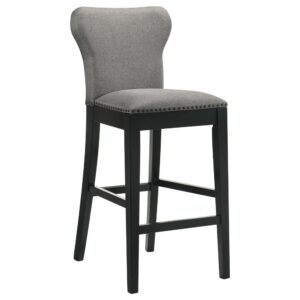 this wingback-inspired stool offers a comfortably seat for elevated dining spaces. A deep black finish frame and tapered legs offer a grounding visual effect