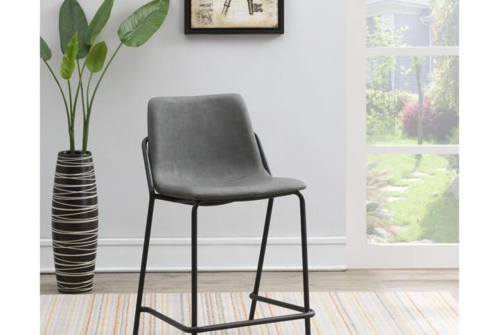 This pair of two stools offer a minimal look and a contemporary vibe. Supported by thin and tall frame in a black finish