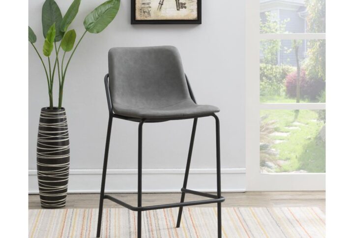 This pair of two stools offer a minimal look and a contemporary vibe. Supported by thin and tall frame in a black finish