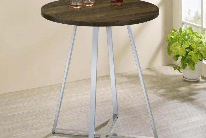 Host your closest friends around this contemporary bar table. Designed with a round