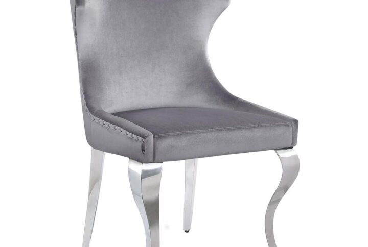 Indulge in the ultimate dining experience with the demi wing dining side chair. Its polished stainless steel cabriole legs exude sophistication