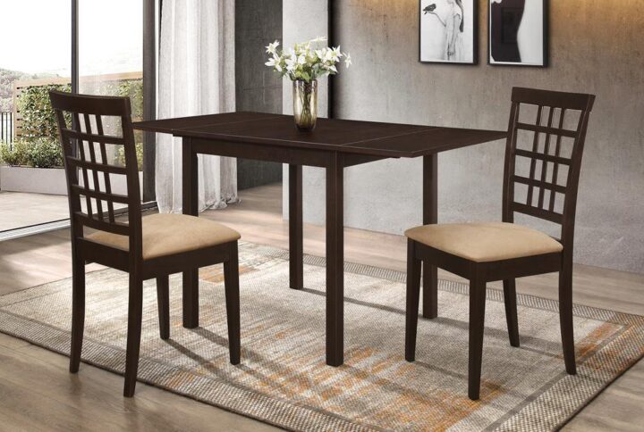 Maximize your dining space with this transitional three-piece dining set that's perfect for a breakfast nook or an apartment setting. The cozy set features a table with a drop-leaf extension and two (2) two-tone lattice-back chairs. The table is crafted with solid block legs and comes in a warm cappuccino finish. The stylish chairs are upholstered in a cushioned tan fabric and tapered legs with the same cappuccino finish as the table. It's a perfect set for a cozy gathering.