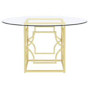 this metallic dining table is a stunning addition to any space. Clear tempered glass top offers a sleek and easy-to-clean solution for a showstopping look. The sleek metal frame features a contemporary openwork pattern. Upgrade your dining room with the retro brass finish on the sharp curves. Enliven a room with the stunning base