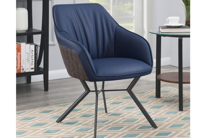 Retro vibes and mixed materials elevate the look of this contemporary dining chair. An upholstered seat features elegant
