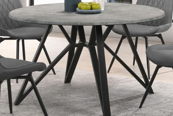Elevate your modern industrial dining area with this retro-inspired round dining table. Designed with a high pressure laminate table top with a concrete-looking decoration paper