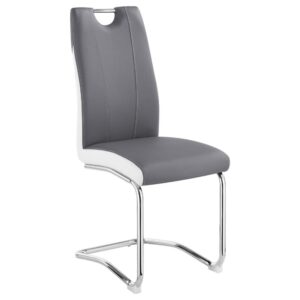 This cantilever style dining chair offers up ultra-modern vibes. Designed with a two-tone upholstered seat