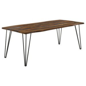designed with a spacious sheesham wood tabletop in a grey finish and natural live-edge details. Retro-inspired hairpin metal legs in a bold gunmetal finish lend an industrial touch that elevates the rich
